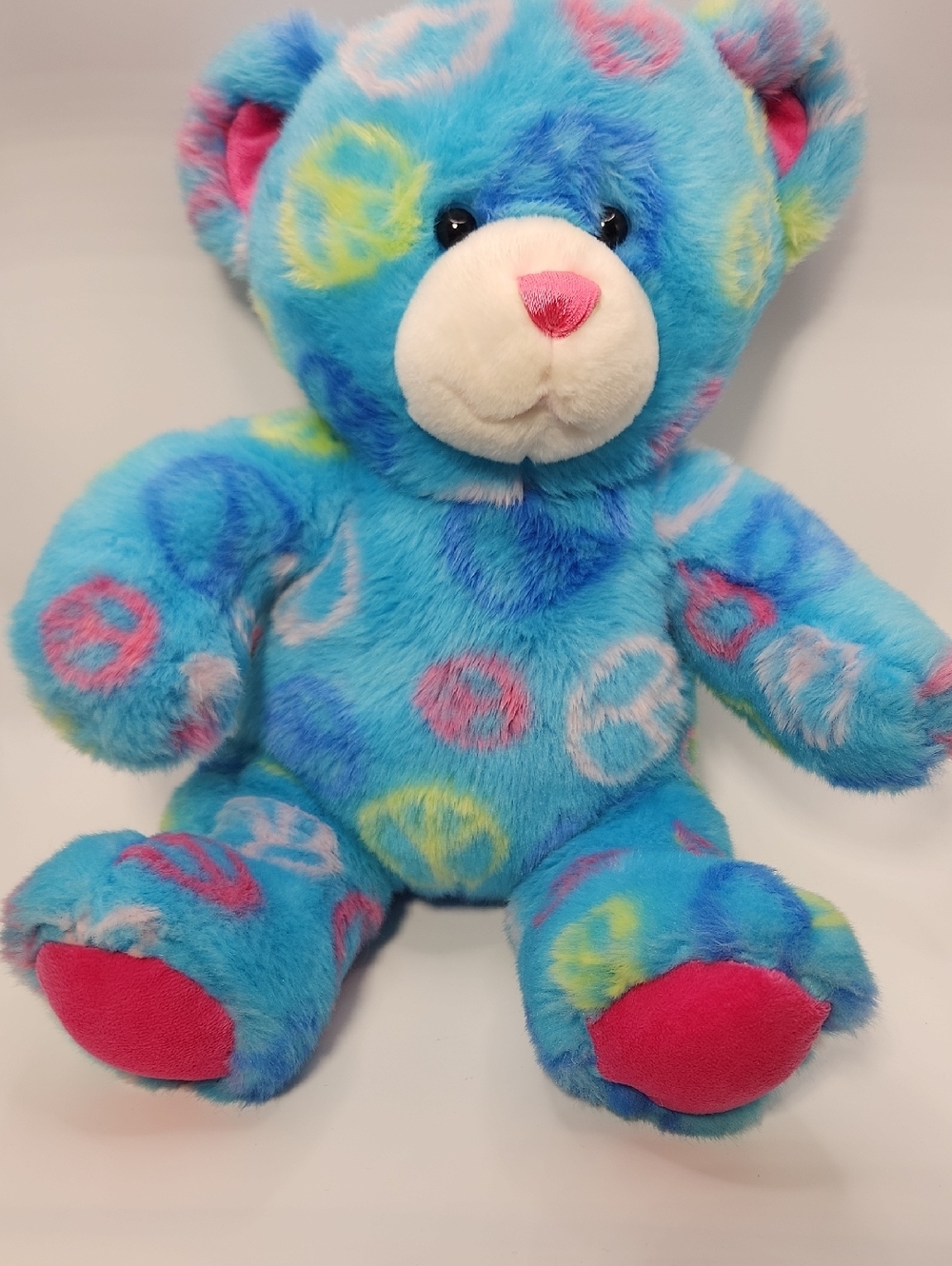 Build-A-Bear Blue Plush Teddy with Pink Accents and Multicolor Peace Signs